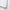 Detailed view of the white corner loop and stitching on a comforter, emphasizing secure construction and clean craftsmanship for duvet attachment.